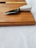 Slotted cutting/serving board